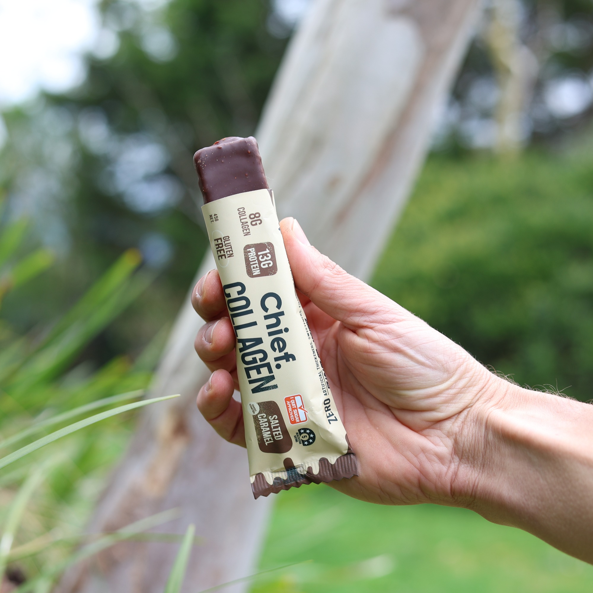 Image of hand holding Chief Collagen Salted Caramel bar 